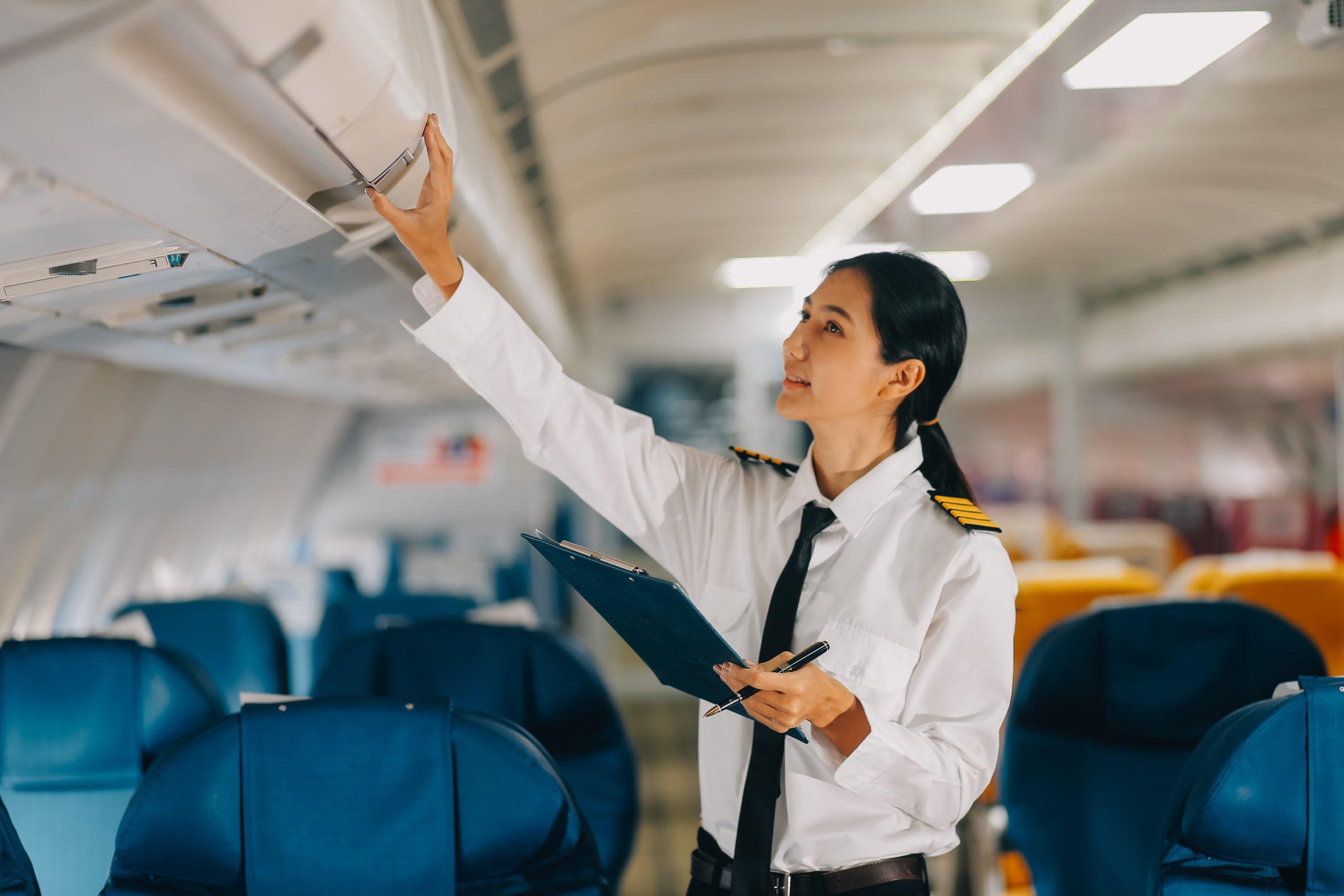 Asian woman working and planning on an airplane. Asian woman rea