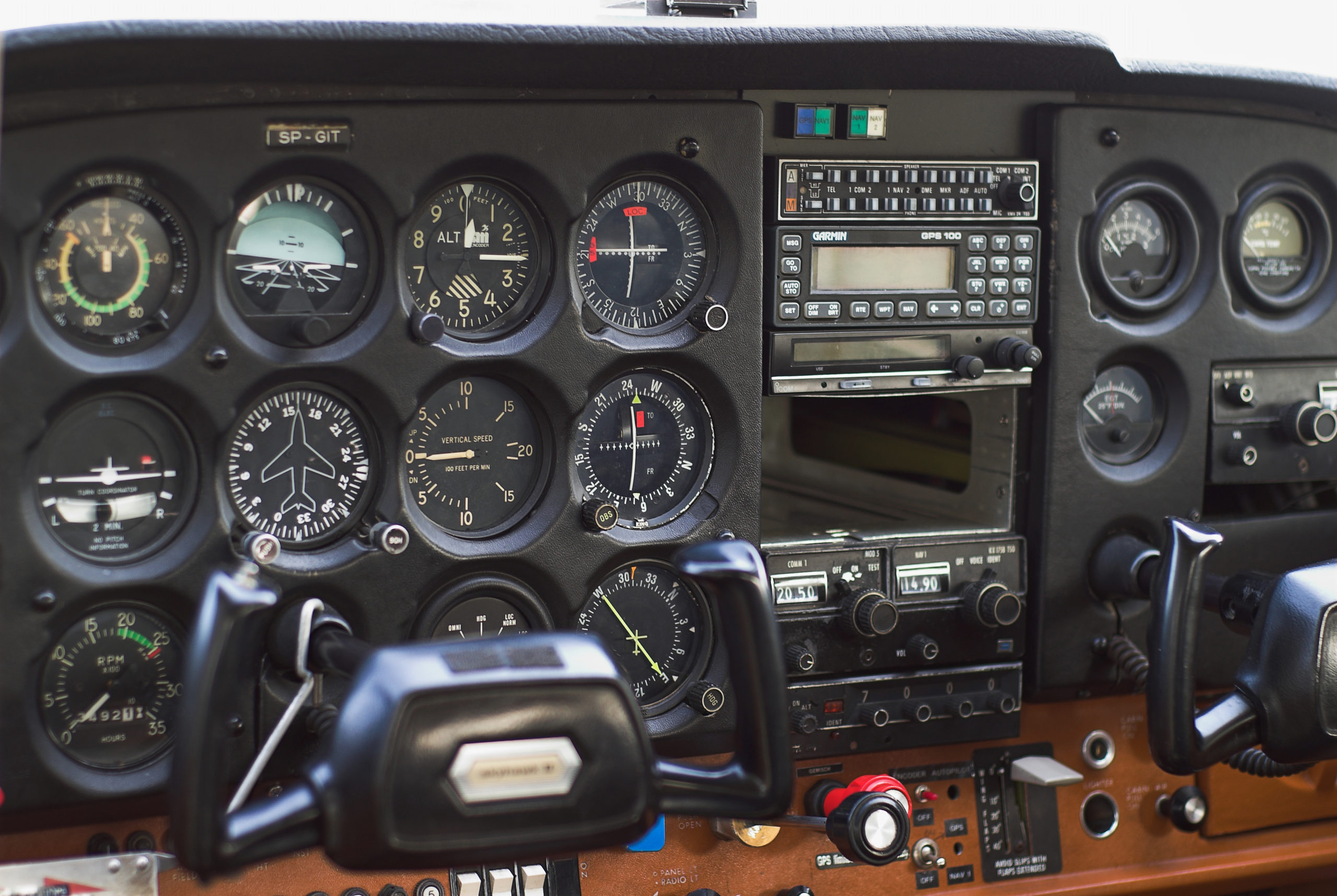 clocks in the cockpit of a small plane